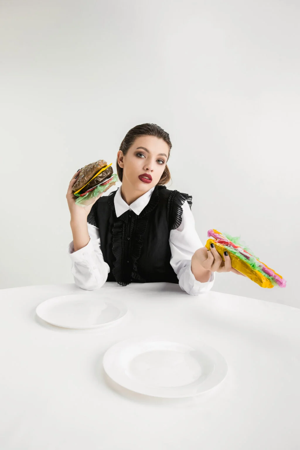Conceptual eco-awareness photo of food wrapped in plastic, symbolising the packaging and sourcing standards we hold ourselves to