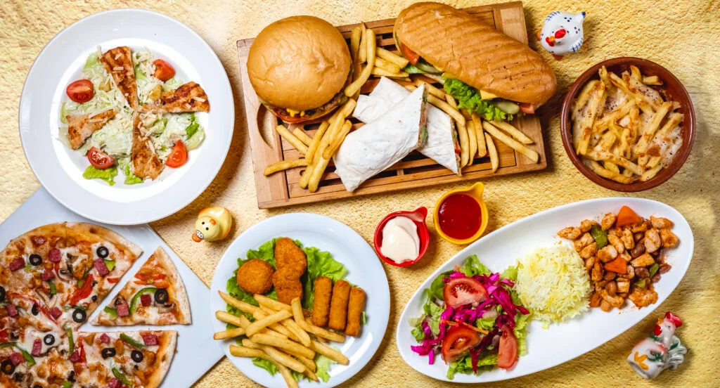 Spread of fried, baked and rice-bowl style ready-to-eat products including burgers, pizza, nuggets and fries